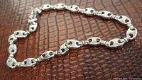 Chain laid flat showing mariner link design and overall length and shape.