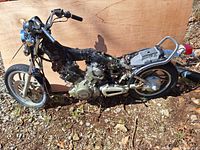 Right side view showing Yamaha 750 Virago engine, rear wheel, and partial frame without seat and fuel tank.