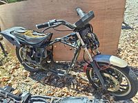 Partial 1982 Yamaha XJ750RJ SECA motorcycle frame showing seat and handlebars with parts missing and deteriorated seat.