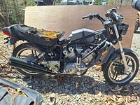 Side profile of 1982 Yamaha XZ550RJ Vision showing frame, engine, wheels, and deteriorated seat.