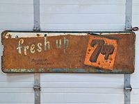 Full view of the large rectangular metal 7Up advertising sign showing overall condition and graphics.