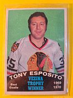 Front of 1969/70 O-Pee-Chee Tony Esposito hockey card showing player image, team jersey, and text with Vezina Trophy winner info.