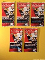 Front view of five sealed Tim Hortons 2018-2019 Upper Deck NHL trading card packs featuring Pittsburgh Penguins player