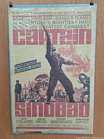 Full view of the 1963 Captain Sindbad movie poster showing colorful hero and title text.