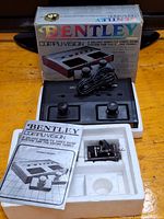 Box, main console unit, two joysticks, manual, game cartridge in packing foam