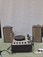 Front view of Califone Stereo 1130K turntable and two speakers, showing overall condition and setup