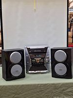 Front view of RCA RS2600 digital audio system with 5-disc changer, dual cassette player, and two speakers