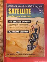 Front cover of 1958 Satellite science fiction pulp magazine featuring artwork of humanoid figure in glass capsule and text about featured stories.