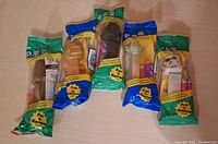 Five unopened vintage Star Wars Pez dispensers in original packaging with candy included.