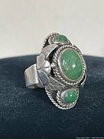 Oblique side view showing leaf motif and twisted wire detail