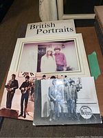 Overall view showing signed photo, two postcards, and book