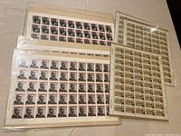 Four sheets of Canada stamps featuring portraits and historical scenes in sealed protective covers, three sheets commemorating William Hamilton Merritt, four commemorating Marguerite Bourgeoys and Alphonse Desjardins