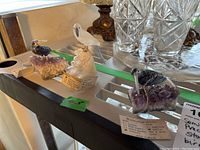 All three stone bird figurines arranged together