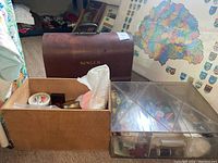 Wide view of Singer wooden case, wooden box with sewing materials, and plastic organizer with sewing supplies.