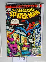 Front cover of Amazing Spider-Man #137 comic book showing Spider-Man and Green Goblin in action.