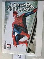 Front cover of Amazing Spiderman #1 variant comic book showing Spider-Man crouched on building ledge.