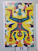 Front cover of Amazing Spider-Man #52 variant comic showing stylized Spider-Man design in bright colors on decorative background.