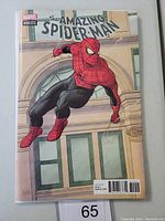 Front cover showing Spider-Man in crouching pose with building facade background and comic title.