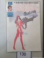 Front cover of Electra #1 Marvel comic shows Electra in red assassin outfit holding a large weapon, marked as #1 in an eight-issue limited series, dated August 1986, priced $1.50.