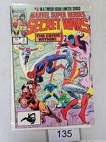 Front cover photo showing Marvel Super Heroes Secret Wars issue 3 comic book with multiple superheroes and title.