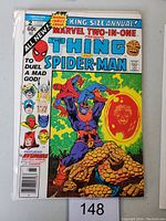 Front cover of Marvel Two-In-One Annual #2 comic book showing The Thing and Spider-Man with Thanos in background