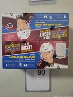 Front and top view of sealed 2020-21 Upper Deck Extended Series Hockey box with player image and product details.