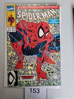 Front cover of Spider-Man #1 comic showing Spider-Man crouching on web background with Marvel branding and title details