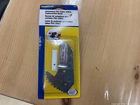 Image of BrassCraft ratcheting PVC cutter replacement blade in original packaging, showing blade with multiple ratchet teeth on a branded backing card.