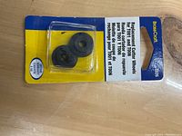 Photo of two black cutter wheels in clear plastic packaging on yellow and blue BrassCraft branded backing card.