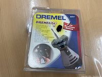 Front view of the Dremel Dremlite 677 LED light attachment in original packaging