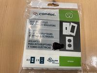 Clear sealed package of Climaloc electric outlet and switch insulators showing front label and quantity detail.