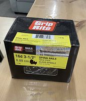 Box of Grip Rite spiral shank nails, showing label with size and weight details