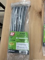 Package of ten Grip Rite smooth shank spikes, 10 inches long, hot-dipped galvanized.