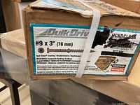 Close up of label showing screw specifications #9 x 3 inch (76 mm), with Quik Guard coating, for composite decking boats.