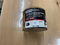 Replacement sanding belt roll with Haussmann brand label and product specifications including size 3x89 inches and grit 80.