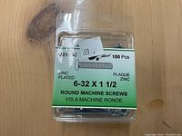 Packaged box containing 100 zinc plated round machine screws sized 6-32 x 1 1/2.