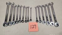 Full set of 15 Mastercraft combination gear wrenches laid out, showing various sizes from smallest at 3/16 inch to largest at 3/4 inch.