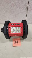 Front view of Milwaukee M18 Rover LED floodlight showing the LED panel with 8 LEDs and control buttons above it.