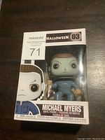 Front view of Michael Myers Funko Pop figure in original box showing figure and packaging details.