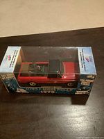 Front angle showing the toy pickup truck inside its original box with clear display window, branding on sides and front including 'Canadian Tire' and 'Ford F Series 1979'