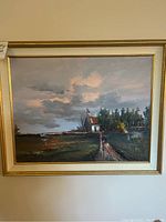 Full view of framed landscape painting showing church, path and sky