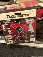 Box of ToolMaster 18V cordless drill showing features and model number 10154