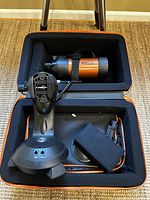 Open case interior showing optical tube strapped in foam, fork mount base, controller, cables