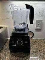 Vitamix Professional Series 750 blender showing full blender with plastic container and handle on countertop.