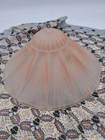 Full view of the frosted glass lampshade showcasing its conical shape and etched Art Deco pattern.