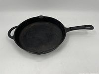 Top view showing the flat cooking surface and both handles of the pan.