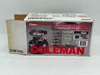 Box of Coleman Sportster II stove and carry case showing front with image of stove, case, and red Coleman logo.