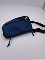 Blue EMS fanny pack with black trim, adjustable strap, and zippered compartments showing full front view.