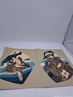 Two vintage First Nations art prints laid on a white background, showing stylized natural elements and wildlife.