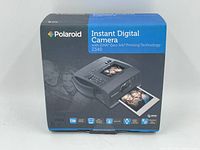 Box front showing Polaroid Instant Digital Camera with ZINK Zero Ink Printing Technology Z340 model.
